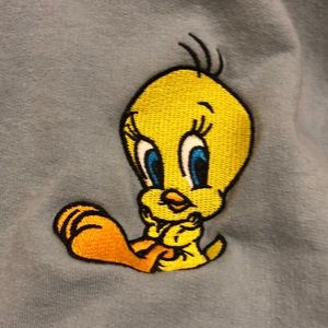 A blue sweatshirt with the looney tunes bird